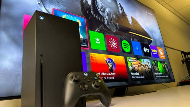An image of an Xbox Series X console in front of a huge Samsung 4K Neo QLED TV