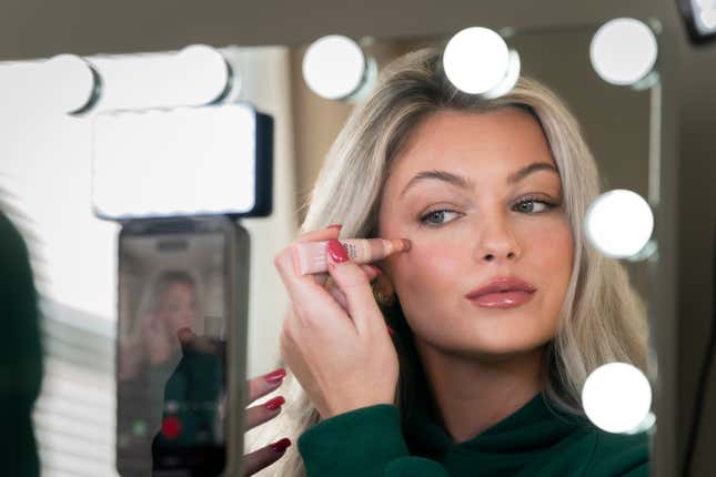 TikToker Allie Pribula poses for a photograph in Mechanicsburg, Pa., Monday, Nov. 20, 2023. More than a decade after debuting on the once-nascent YouTube creator community, “Get Ready with Me” videos have inundated social media. Pribula, a 25-year-old TikToker who used to be an elementary school teacher in the Philadelphia suburbs, says she started making GRWM videos as a way to process her feelings about her old job. (AP Photo/Matt Rourke)