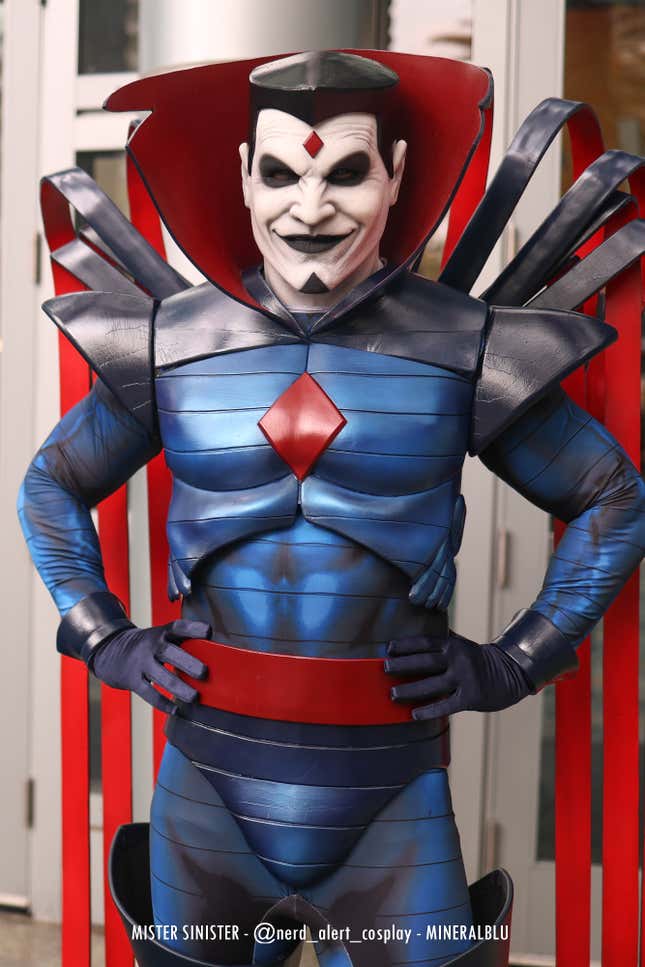 Mister Sinister stands with his hands on his hips. 