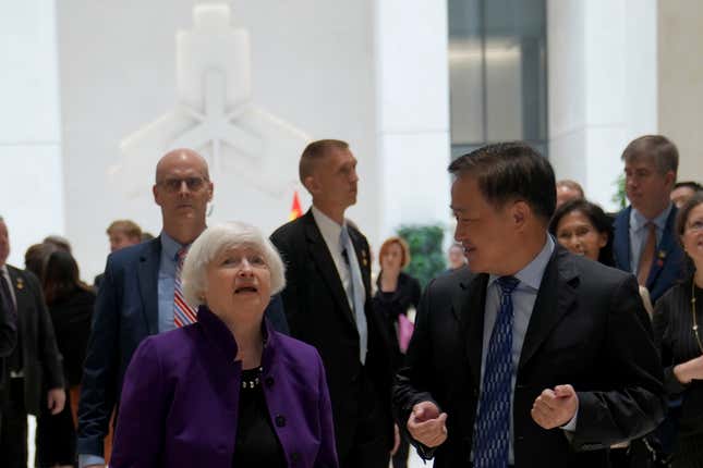 U.S. Treasury Secretary Janet Yellen, left, walks with Governor of the People&#39;s Bank of China Pan Gongsheng as they meet at the People&#39;s Bank of China in Beijing Monday, April 8, 2024. (AP Photo/Tatan Syuflana, Pool)