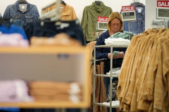 A woman pauses while shopping at a Kohl&#39;s store in Clifton, N.J., Jan. 26, 2024. On Thursday, Feb. 29, 2024, the Commerce Department issues its January report on consumer spending. (AP Photo/Seth Wenig)