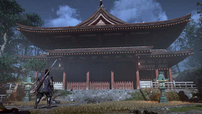 Yasuke stands before a large building.