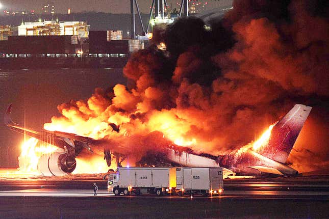 his photo provided by Jiji Press shows a Japan Airlines plane on fire on a runway of Tokyo's Haneda Airport on January 2, 2024.