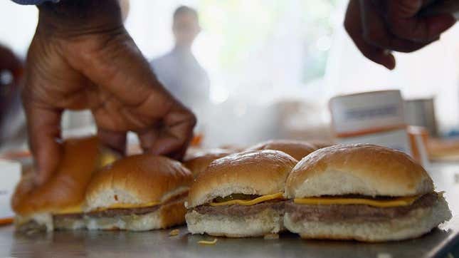 hands preparing white castle slider