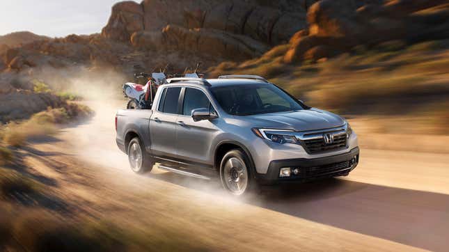 Silver Honda Ridgeline front-quarter view on dirt trail