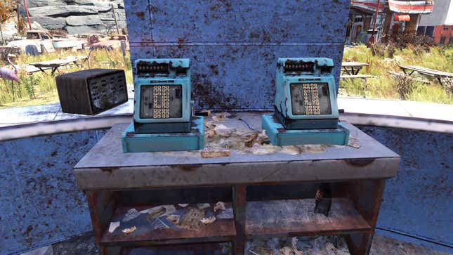 Two abandoned cash registers sit on table.