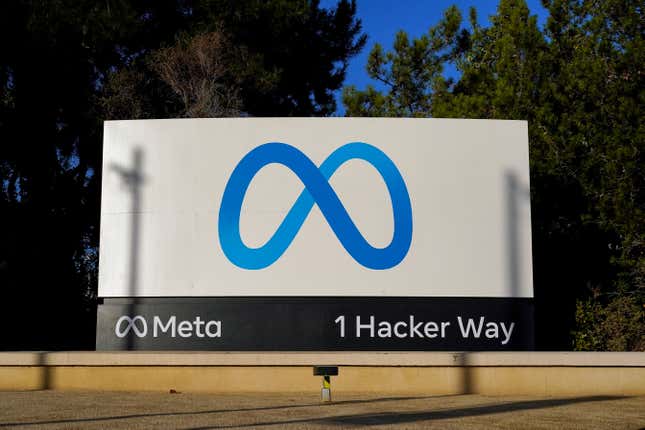 Meta's logo is seen on a sign