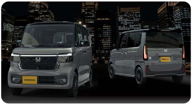 A photo of the front and rear of a gray Honda N-Box at night in front of big buildings