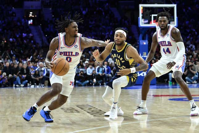 Nov 12, 2023; Philadelphia, Pennsylvania, USA; Philadelphia 76ers guard Tyrese Maxey (0) drives to the basket against Indiana Pacers forward Bruce Brown (11) during the fourth quarter at Wells Fargo Center.