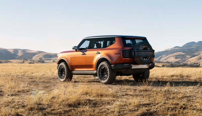 Rear 3/4 view of an orange Scout Traveler