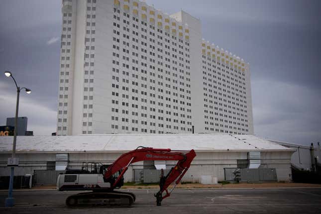 Construction equipment is parked in back of the Tropicana hotel-casino Thursday, March 28, 2024, in Las Vegas. The casino, which is closing April 2, will be demolished to make room for a proposed baseball stadium. (AP Photo/John Locher)