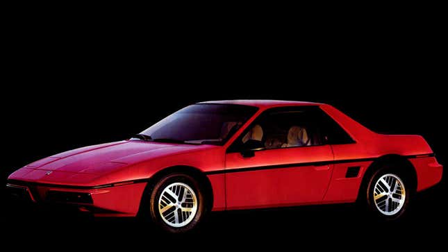 A photo of a red Pontiac Fiero sports car.