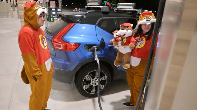 Ricky Nguyen, left, and his wife Lisa fill up their gas tank at the newly opened Buc-ees Travel Center in Johnstown, Colorado on March 18, 2024. Established in 1982, Buc-ees has expanded to 34 stores in Texas and 14 others across different states. The Johnstown outlet marks Buc-ees debut in Colorado.