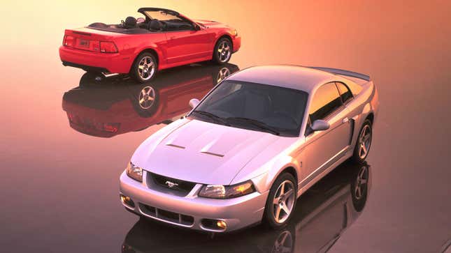 A photo of two Ford Mustang coupes. 