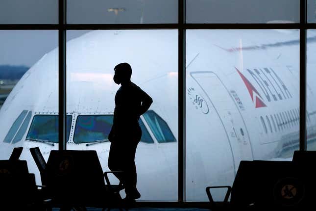 FILE - A passenger waits for a Delta Airlines flight at Hartsfield-Jackson International Airport in Atlanta on Feb. 18, 2021. The U.S. Department of Transportation said Thursday, March 21, 2024, that it will review how airlines protect personal information about their passengers and whether they are making money by sharing that information with other parties. (AP Photo/Charlie Riedel, File)