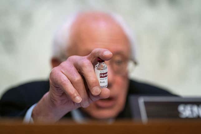 Senator Bernie Sanders holding a bottle of insulin