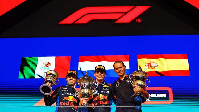  Race winner Max Verstappen of the Netherlands and Oracle Red Bull Racing, Second placed Sergio Perez of Mexico and Oracle Red Bull Racing and Tom Hart, Performance Engineer at Oracle Red Bull Racing pose for a photo on the podium during the F1 Grand Prix of Bahrain at Bahrain International Circuit on March 02, 2024 in Bahrain, Bahrain. 