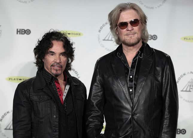 FILE - Hall of Fame Inductees John Oates, left, and Daryl Hall appear in the press room at the Rock and Roll Hall of Fame Induction Ceremony on April, 10, 2014, in New York. After more than a half-century of making music together, Hall is suing Oates over a proposed sale of his share of a Hall &amp; Oates business partnership that Hall says he hasn&#39;t approved. A Nashville judge recently paused the sale of Oates&#39; stake in Whole Oats Enterprises LLP to Primary Wave IP Investment Management LLC pending arbitration, or until Feb. 17, 2024. (Photo by Andy Kropa/Invision/AP, File)