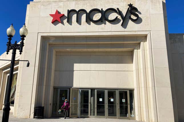 FILE - A shopper exits Macy&#39;s at the Woodfield Old Orchard Shopping Center in Skokie, Ill., Feb. 19, 2022. Macy’s is rejecting a $5.8 billion takeover offer from investment firms Arkhouse Management and Brigade Capital Management, saying they didn’t provide a viable financing plan. Arkhouse and Brigade offered $21 per share for the stock they don’t already own. The department store chain also said there was a lack of compelling value in the non-binding proposal. The move comes a week after Macy&#39;s announced job cuts and store closures. (AP Photo/Nam Y. Huh, file)