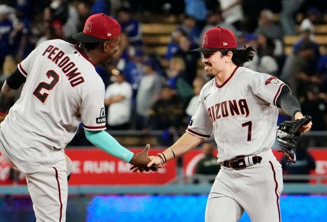 Corbin Carroll of the Arizona Diamondbacks celebrates with Geraldo