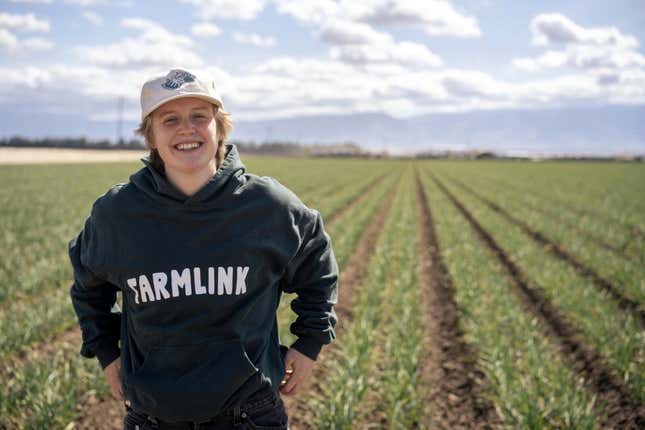 This 2022 photo shows Kate Nelson in Bakersfield, Calif,, after attending a Farmlink Project food delivery in Bakersfield to support the farmer community. Farmlink Project is one of numerous nonprofits established by Gen Z founders during the COVID-19 pandemic. (Owen Dubeck/Farmlink Project via AP)