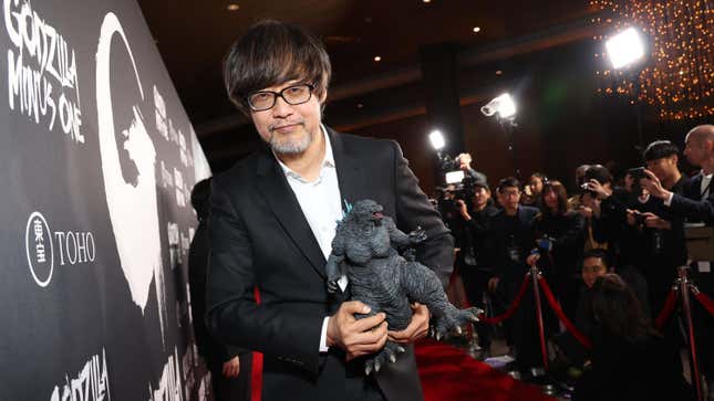 Takashi Yamazaki with a Godzilla figure