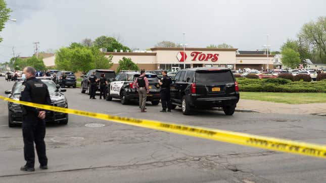 Police cars surround the Tops store.