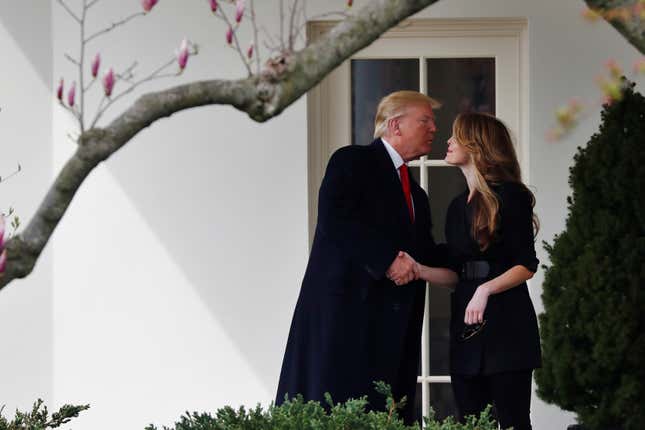 U.S. President Donald Trump shakes hands with former White House Communications Director Hope Hicks outside of the Oval Office as he departs the White House for a trip to Cleveland, Ohio on March 29, 2018.