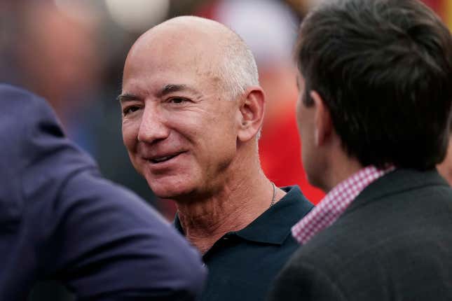 FILE - Amazon founder Jeff Bezos is seen on the sidelines before the start of an NFL football game, Sept. 15, 2022, in Kansas City, Mo. After nearly three decades, Bezos is leaving Seattle. In a Instagram post, the Amazon founder announced plans to return to Miami — where he spent his high school years — to be closer to his parents and his partner, Lauren Sánchez. (AP Photo/Charlie Riedel, File)