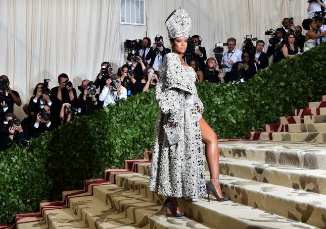 Rihanna arrives for the 2018 Met Gala on May 7, 2018, at the Metropolitan Museum of Art in New York. The Gala raises money for the Metropolitan Museum of Art’s Costume Institute. The Gala’s 2018 theme is “Heavenly Bodies: Fashion and the Catholic Imagination.”