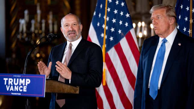 Howard Lutnick, Trump’s pick for Commerce Secretary, with Trump at Mar-a-Lago on Dec. 16.