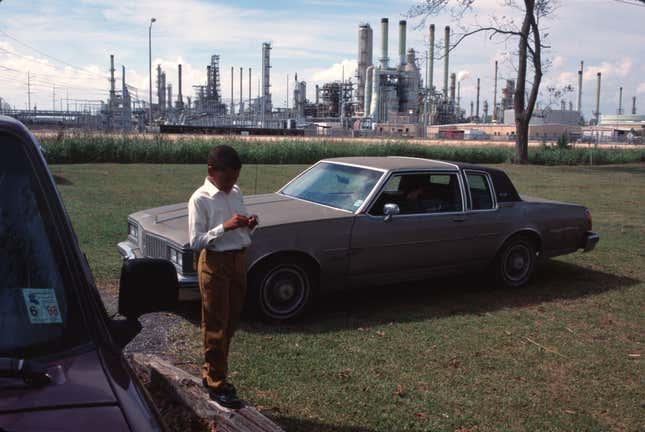 Oil and chemical refinery plants cover the landscape, next to African American communities along the Mississippi River, October, 1998, south of Baton Rouge, Louisiana. 