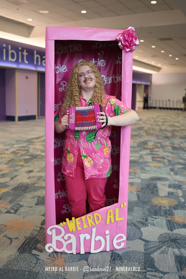 Weird Al Barbie holds an accordion. 
