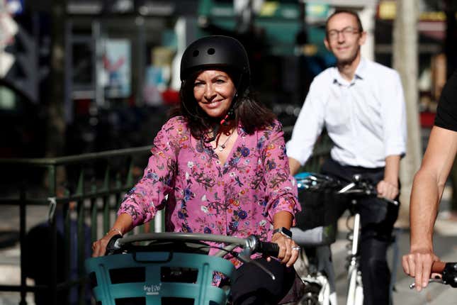 Mayor of Paris Anne Hidalgo rides a Velib Metropole self-service public bike by Smovengo on the newly created secure bicycle facilities in Paris, France, September 4, 2019.