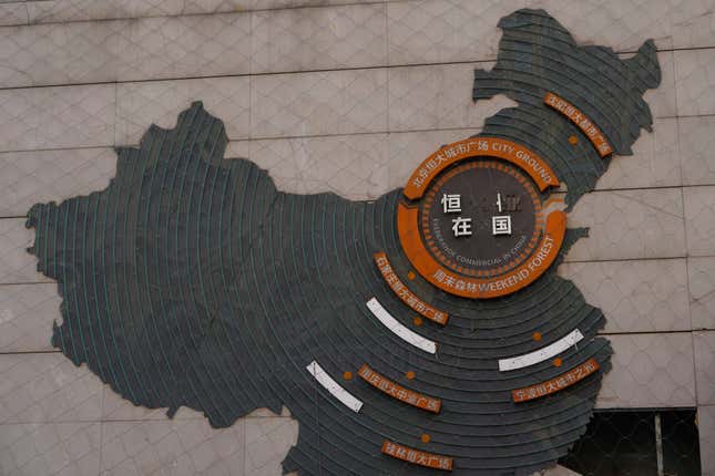 Letterings are missing on a depiction of Evergrande properties across a China map at a partially shuttered Evergrande commercial complex in Beijing, Monday, Jan. 29, 2024. Chinese property developer China Evergrande Group on Monday was ordered to liquidate by a Hong Kong court, after the firm was unable to reach a restructuring deal with creditors. (AP Photo/Ng Han Guan)