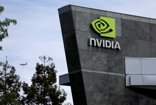 Nvidia logo on the corner of a grey building against a blue sky