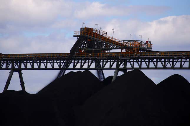 Coal is unloaded onto large piles at Australia's Ulan Coal mines