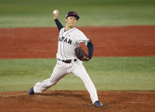 Aug 4, 2021; Yokohama, Japan; Team Japan pitcher Yoshinobu Yamamoto (17) throws a pitch against Korea in a baseball semifinal match during the Tokyo 2020 Olympic Summer Games at Yokohama Baseball Stadium.