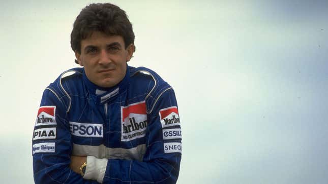 A photo of Tyrrell Ford driver Jean Alesi in his blue fire suit. 