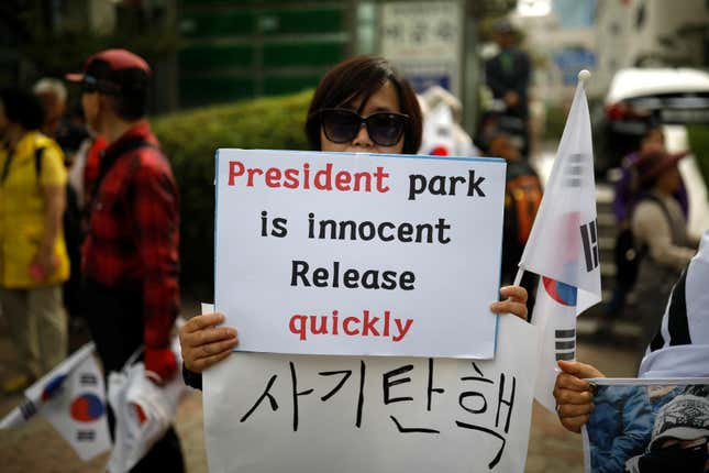 A supporter of Park Geun-hye held a sign in front of a court in Seoul in May 2017.
