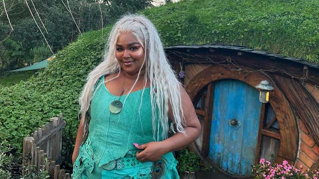 Lizzo elf in front of Hobbit home