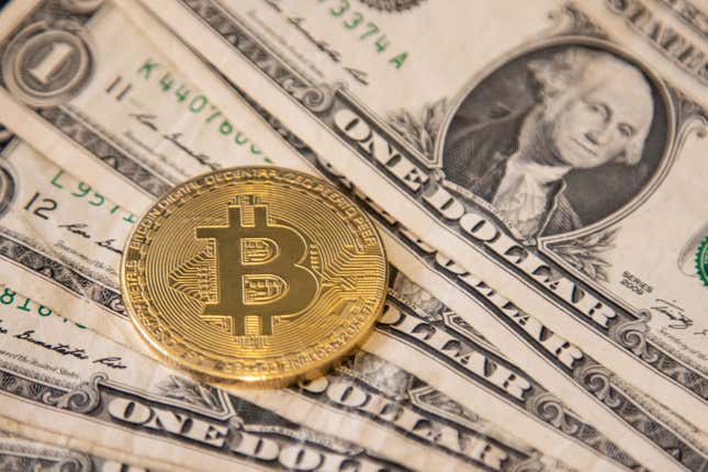 Image for article titled Bitcoin tumbles to less than $100,000 as a strong U.S. dollar hits crypto