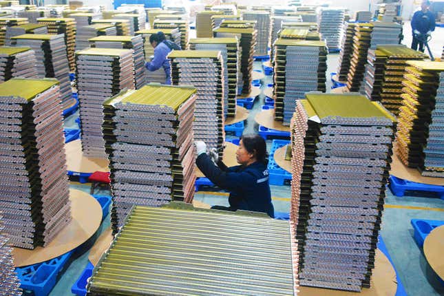 Workers labor at a factory of coolant radiators for air conditioners in Yuexi county in central China&#39;s Anhui province, on Feb. 21, 2024. Manufacturing in China contracted for a fifth consecutive month in February, according to an official survey of factory managers released Friday, March 1, 2024, reflecting persistent weakness in the economy ahead of annual legislative meetings where officials are expected to boost policy support. (Chinatopix via AP)