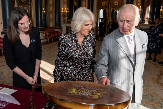 FILE - Britain&#39;s King Charles III and Queen Camilla view part of the Royal Collection relating to the Royal family&#39;s connection to Kenya, during a reception for the Kenyan diaspora in the UK at Buckingham Palace, central London, Oct. 24, 2023. King Charles III wants to look to the future when his four-day state visit to Kenya starts on Tuesday Oct. 31, 2023. But first he will have to confront the past. (Aaron Chown/Pool via AP, file)