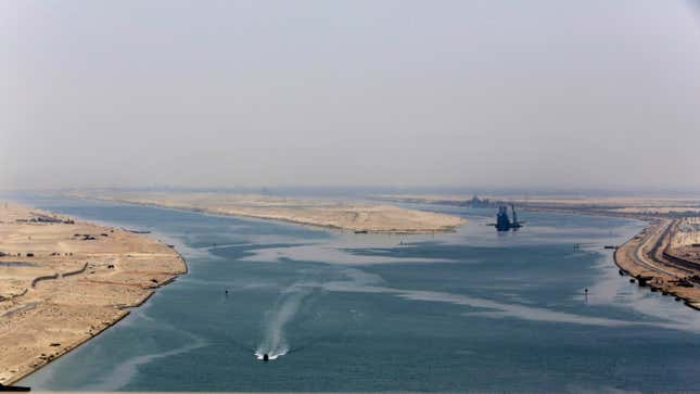 FILE - An army zodiac secures the entrance of the new section of the Suez Canal in Ismailia, Egypt, on Aug. 6, 2015. China, the world’s biggest exporter, says it is deeply concerned about tensions in the Red Sea that have upended global trade by forcing many shippers to avoid the Suez Canal. (AP Photo/Amr Nabil, File)