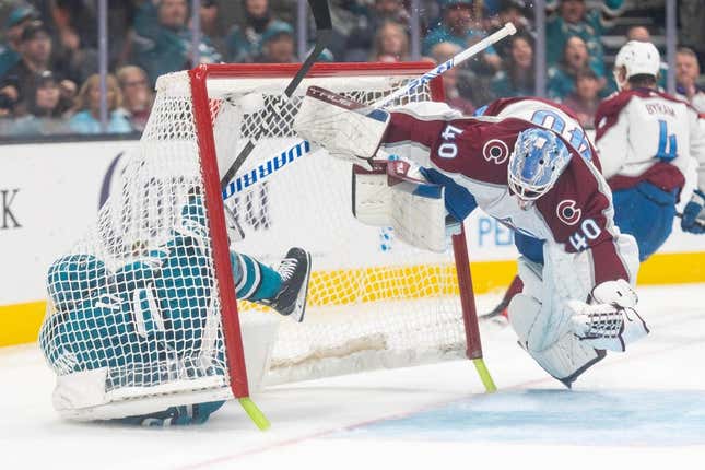 Oct 14, 2023; San Jose, California, USA; Colorado Avalanche goaltender Alexandar Georgiev (40) dodges San Jose Sharks center Luke Kunin (11) during the second period at SAP Center at San Jose.