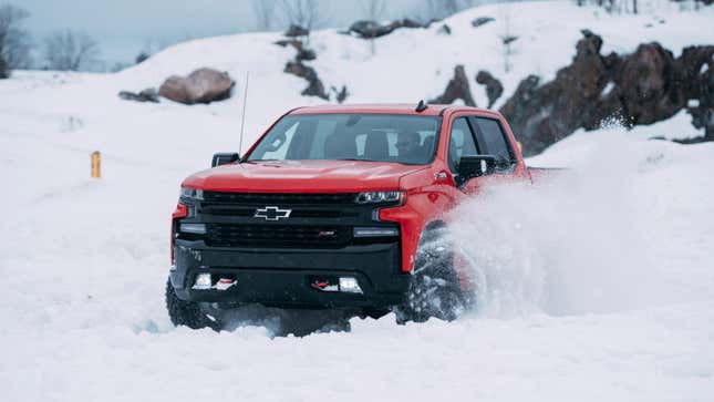 A photo of a red Chevrolet Silverado pickup truck. 