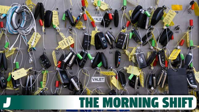 A photo of car keys handing in a dealership. 