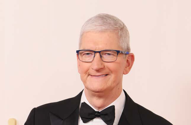 Tim Cook wearing glasses smiling