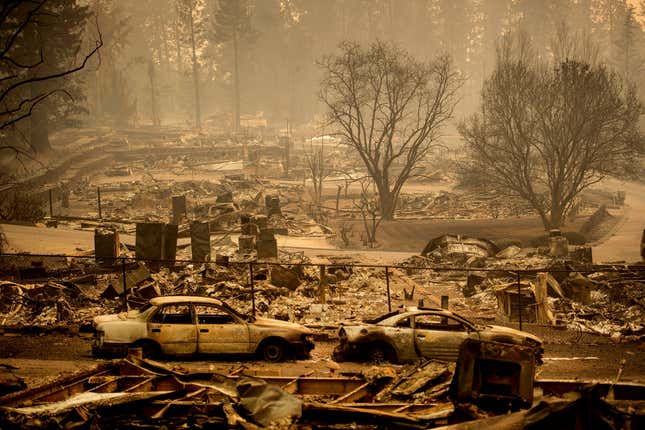 FILE - Homes leveled by the Camp Fire line a development on Edgewood Lane in Paradise, Calif., on Nov. 12, 2018. State Farm will discontinue coverage for 72,000 houses and apartments in California starting summer 2024, the insurance giant said. The Illinois-based company, California&#39;s largest insurer, cited soaring costs, the increasing risk of catastrophes like wildfires and outdated regulations as reasons it won’t renew the policies on 30,000 houses and 42,000 apartments, the Bay Area News Group reported Thursday, March 21, 2024. (AP Photo/Noah Berger, File)